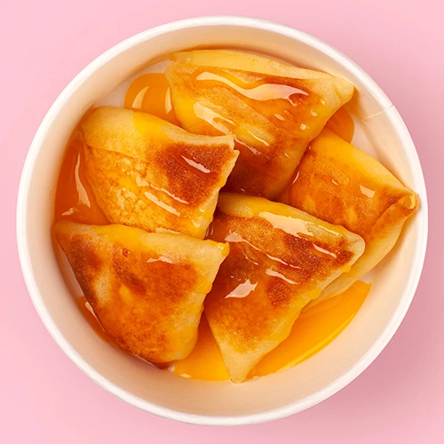 Млинці з заварним кремом в апельсиновому соусі